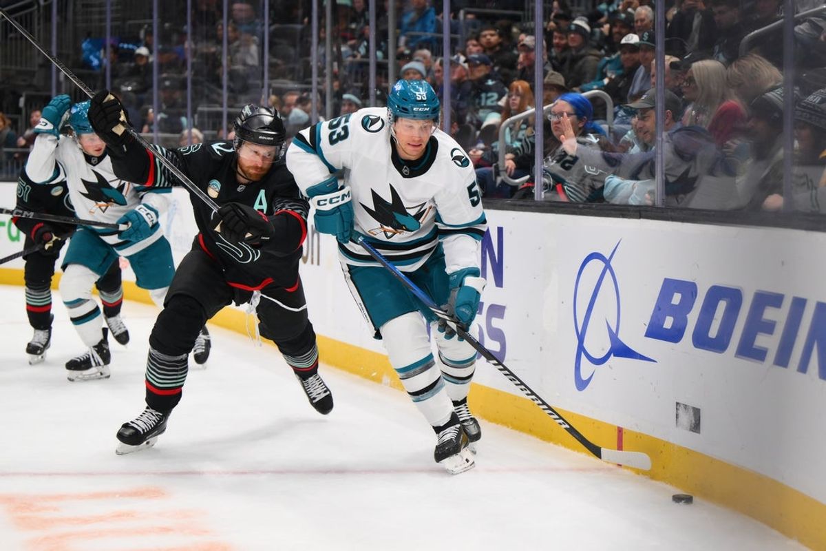 Nov 5, 2025; Seattle, Washington, USA; San Jose Sharks left wing Jeff Skinner (53) plays the puck while defended by Seattle Kraken defenseman Adam Larsson (6) during the third period at Climate Pledge Arena. Mandatory Credit: Steven Bisig-Imagn Images