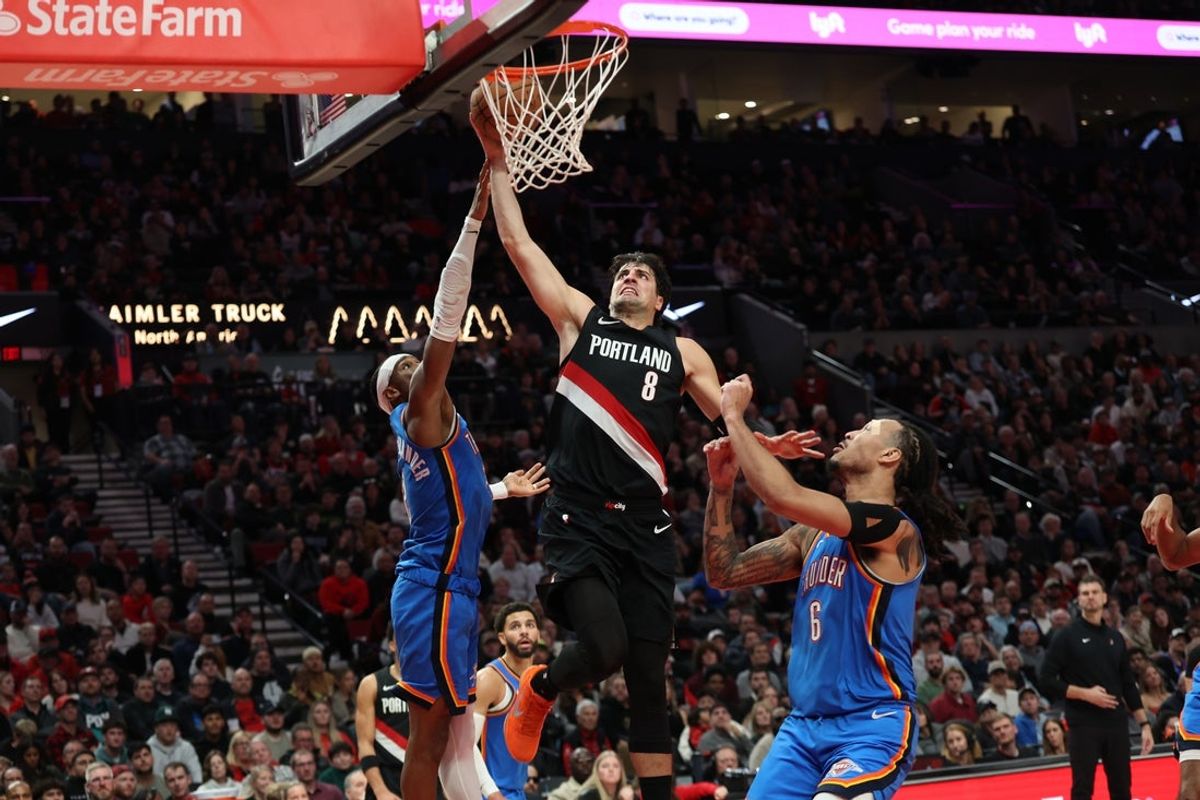Nov 5, 2025; Portland, Oregon, USA; Portland Trail Blazers forward Deni Avdija (8) dunks the ball over Oklahoma City Thunder guard Shai Gilgeous-Alexander (2) and Thunder’s  forward Jaylin Williams (6) during the second half at Moda Center. Mandatory Credit: Jaime Valdez-Imagn Images
