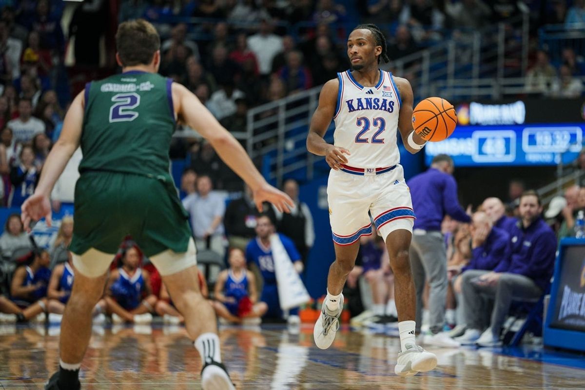 Nov 3, 2025; Lawrence, Kansas, USA; Kansas Jayhawks guard Darryn Peterson (22) dribbles the ball during the second half against the Green Bay Phoenix at Allen Fieldhouse. Mandatory Credit: Jay Biggerstaff-Imagn Images