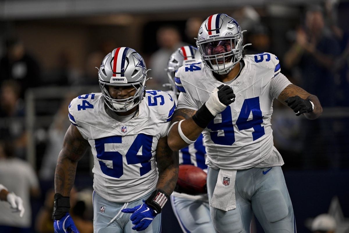 Nov 3, 2025; Arlington, Texas, USA; Dallas Cowboys defensive end Marshawn Kneeland (94) and defensive end Sam Williams (54) celebrates after returning a blocked punt for a touchdown during the game between the Dallas Cowboys and the Arizona Cardinals at AT&T Stadium. Mandatory Credit: Jerome Miron-Imagn Images