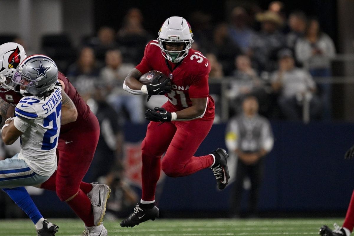 Nov 3, 2025; Arlington, Texas, USA; Arizona Cardinals running back Emari Demercado (31) runs with the ball during the game between the Dallas Cowboys and the Arizona Cardinals at AT&T Stadium. Mandatory Credit: Jerome Miron-Imagn Images