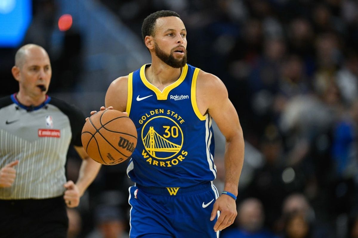 Nov 4, 2025; San Francisco, California, USA; Golden State Warriors guard Stephen Curry (30) dribbles against the Phoenix Suns in the fourth quarter at Chase Center. Mandatory Credit: Eakin Howard-Imagn Images