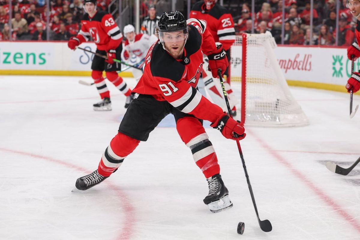 Nov 6, 2025; Newark, New Jersey, USA; New Jersey Devils center Dawson Mercer (91) plays the puck against the Montréal Canadiens during the first period at Prudential Center. Mandatory Credit: Ed Mulholland-Imagn Images