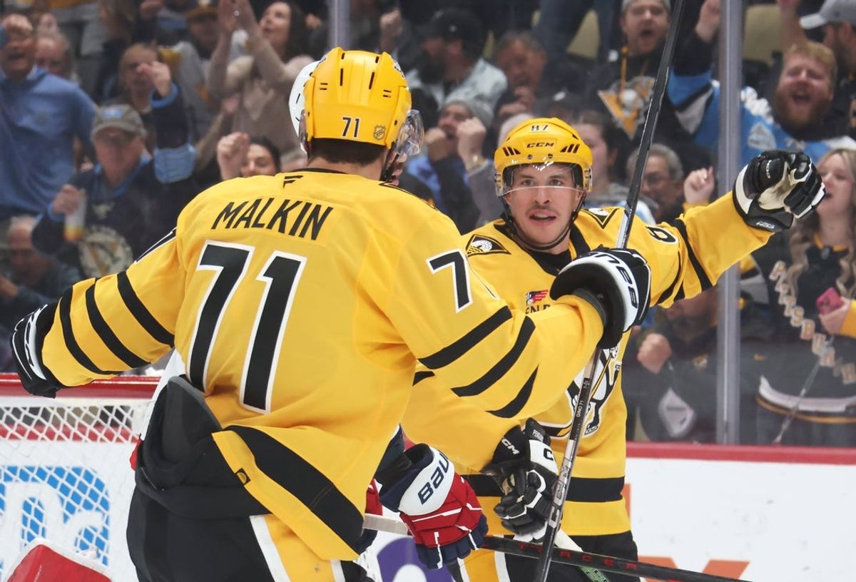 Nov 6, 2025; Pittsburgh, Pennsylvania, USA;  Pittsburgh Penguins center Sidney Crosby (87) celebrates his second power play goal of the game with center Evgeni Malkin (71) against the Washington Capitals during the first period at PPG Paints Arena. Mandatory Credit: Charles LeClaire-Imagn Images