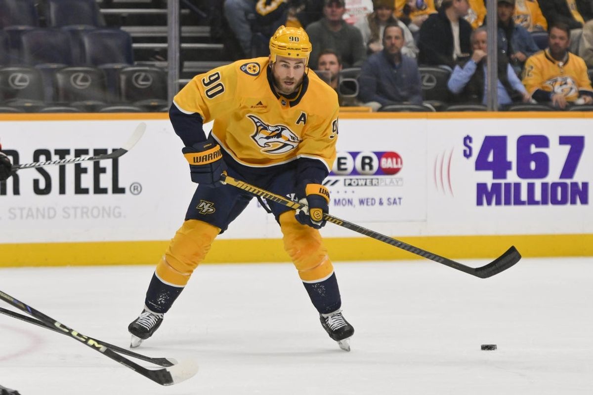 Nov 6, 2025; Nashville, Tennessee, USA;  Nashville Predators center Ryan O'Reilly (90) skates with the puck against the Philadelphia Flyersduring the first period at Bridgestone Arena. Mandatory Credit: Steve Roberts-Imagn Images