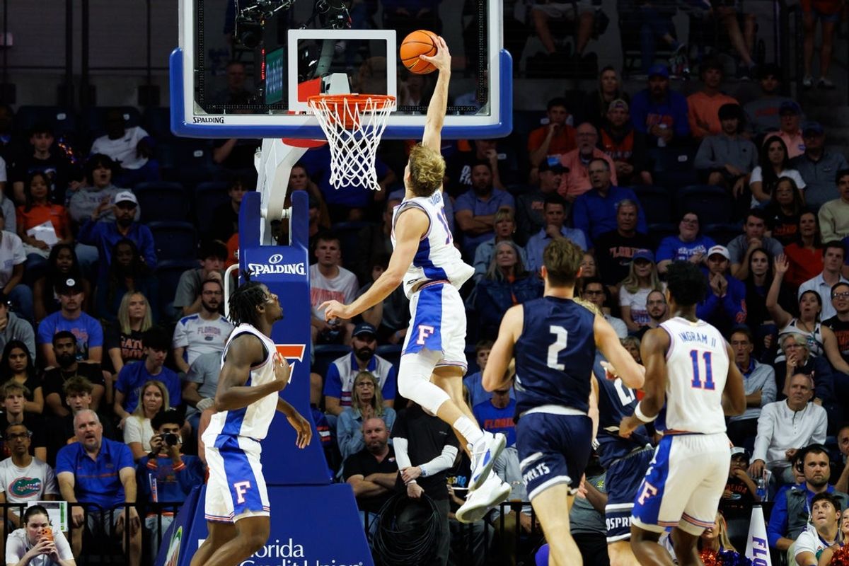 Nov 6, 2025; Gainesville, Florida, USA; Florida Gators forward Thomas Haugh (10) dunks the ball against the North Florida Ospreys during the first half at Exactech Arena at the Stephen C. O'Connell Center. Mandatory Credit: Matt Pendleton-Imagn Images