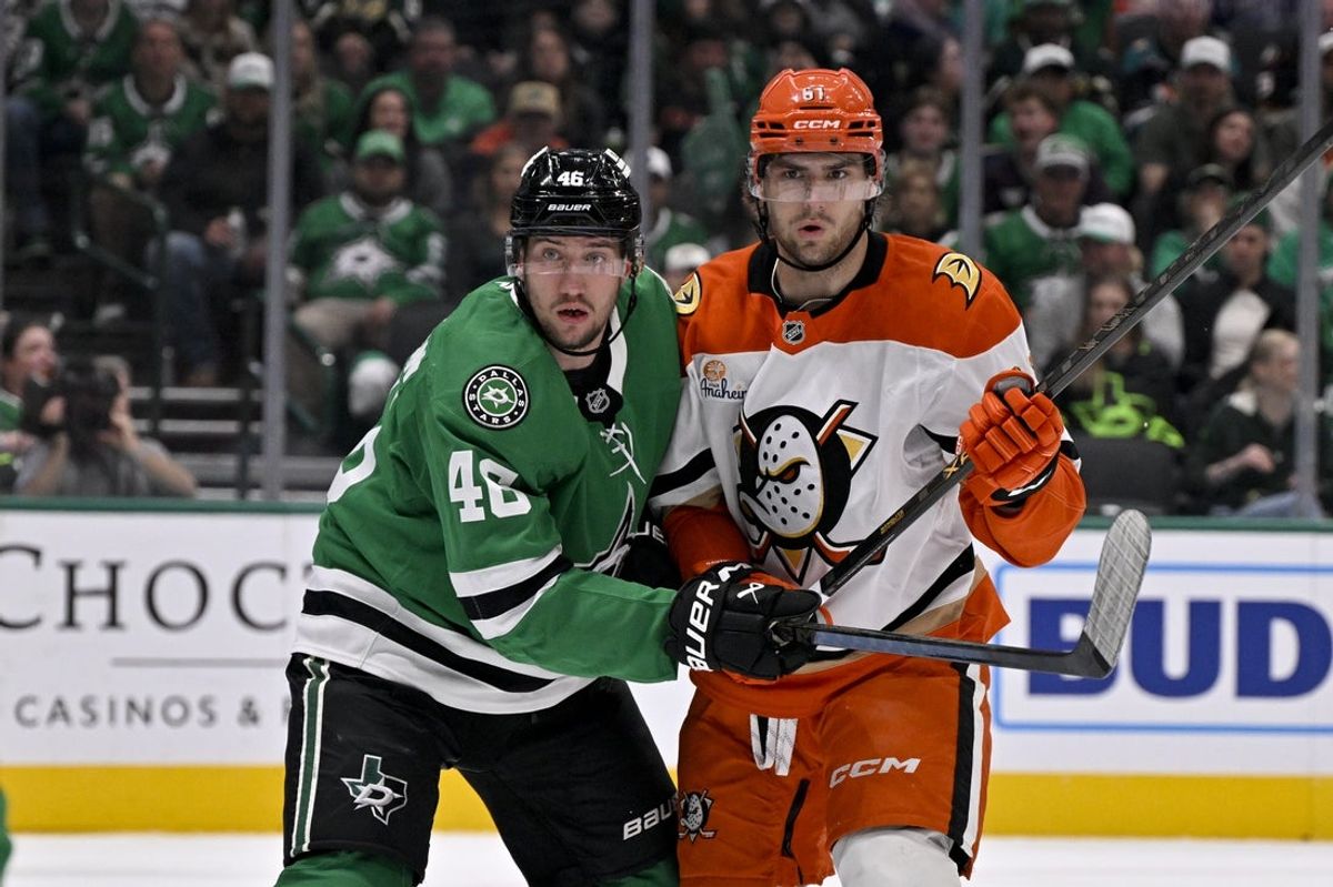 Nov 6, 2025; Dallas, Texas, USA; Dallas Stars defenseman Ilya Lyubushkin (46) and Anaheim Ducks left wing Cutter Gauthier (61) look for the puck during the first period at the American Airlines Center. Mandatory Credit: Jerome Miron-Imagn Images