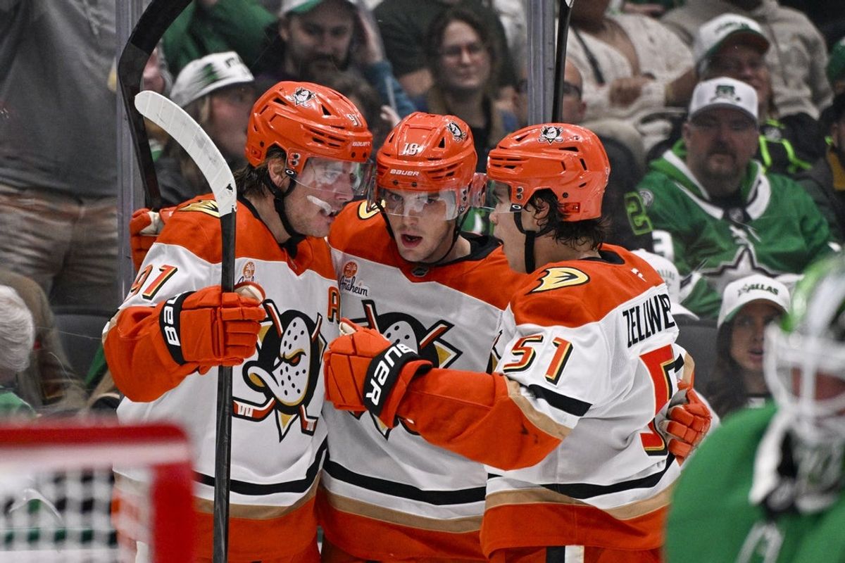 Nov 6, 2025; Dallas, Texas, USA; Anaheim Ducks center Leo Carlsson (91) and defenseman Olen Zellweger (51) and right wing Troy Terry (19) celebrates a short handed goal scored by Carlsson against the Dallas Stars during the third period at the American Airlines Center. Mandatory Credit: Jerome Miron-Imagn Images