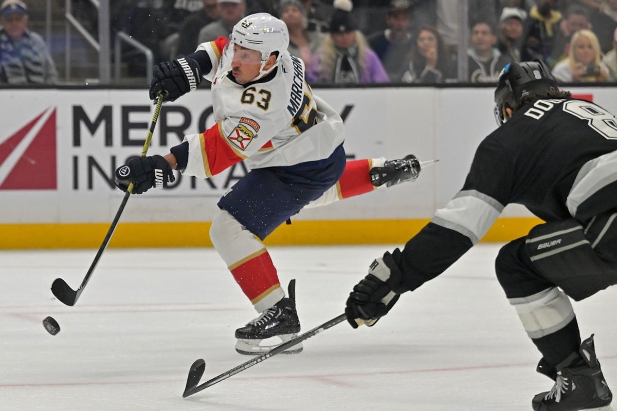 Nov 6, 2025; Los Angeles, California, USA;  Florida Panthers left wing Brad Marchand (63) scores a goal as he gets past Los Angeles Kings defenseman Drew Doughty (8) during the third period at Crypto.com Arena. Mandatory Credit: Jayne Kamin-Oncea-Imagn Images