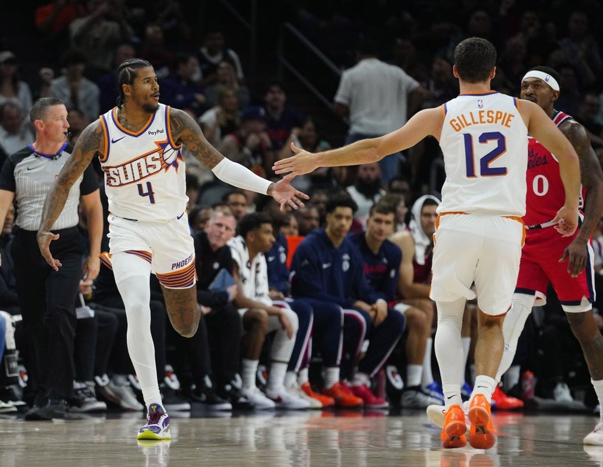 Suns guard Jalen Green (4) celebrates a three pointer against the Clippers with guard Collin Gillespie (12) during a game at the Mortgage Matchup Center on Nov. 6, 2025.