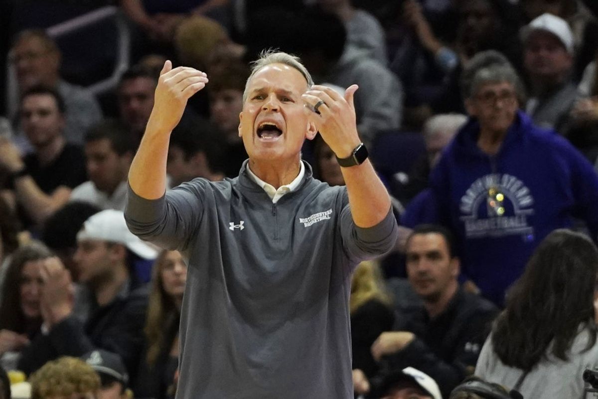 Nov 7, 2025; Evanston, Illinois, USA; Northwestern Wildcats head coach Chris Collins gestures to his team against the Boston University Terriers during the first half at Welsh-Ryan Arena. Mandatory Credit: David Banks-Imagn Images