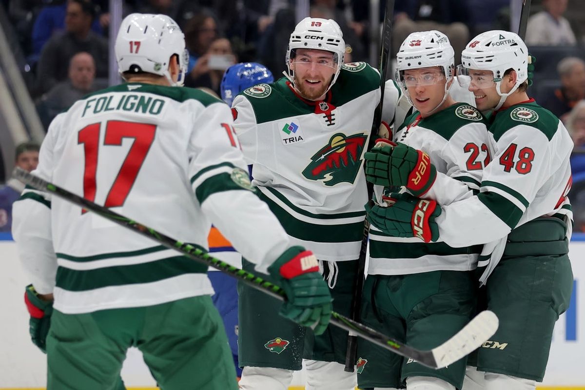 Nov 7, 2025; Elmont, New York, USA; Minnesota Wild right wing Danila Yurov (22) celebrates his goal against the New York Islanders with left wing Marcus Foligno (17) and center Yakov Trenin (13) and defenseman Daemon Hunt (48) during the first period at UBS Arena. Mandatory Credit: Brad Penner-Imagn Images