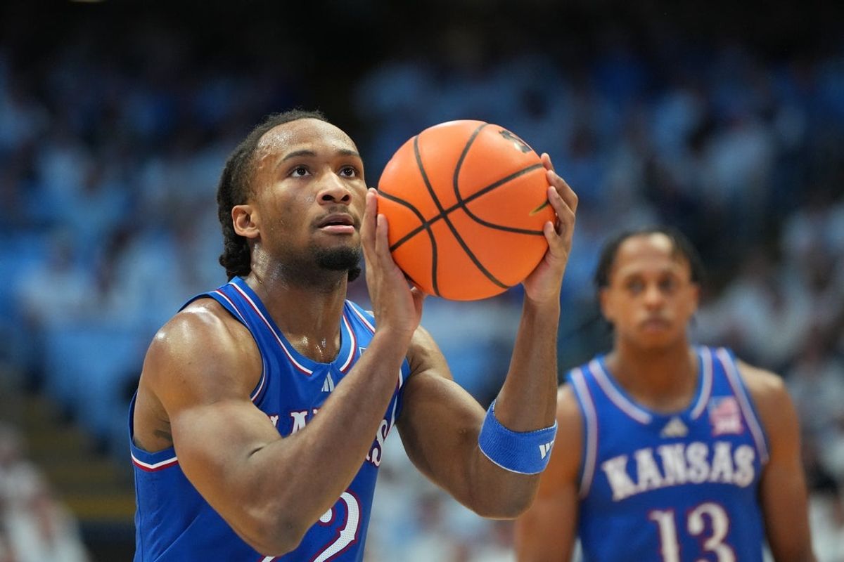 Nov 7, 2025; Chapel Hill, North Carolina, USA;  Kansas Jayhawks guard Darryn Peterson (22) on the line in the first half at Dean E. Smith Center. Mandatory Credit: Bob Donnan-Imagn Images