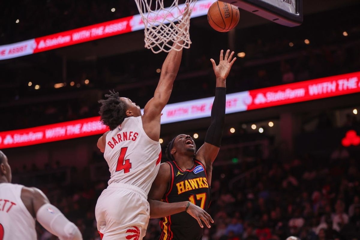 Nov 7, 2025; Atlanta, Georgia, USA; Atlanta Hawks forward Onyeka Okongwu (17) shoots past Toronto Raptors forward Scottie Barnes (4) in the first quarter at State Farm Arena. Mandatory Credit: Brett Davis-Imagn Images