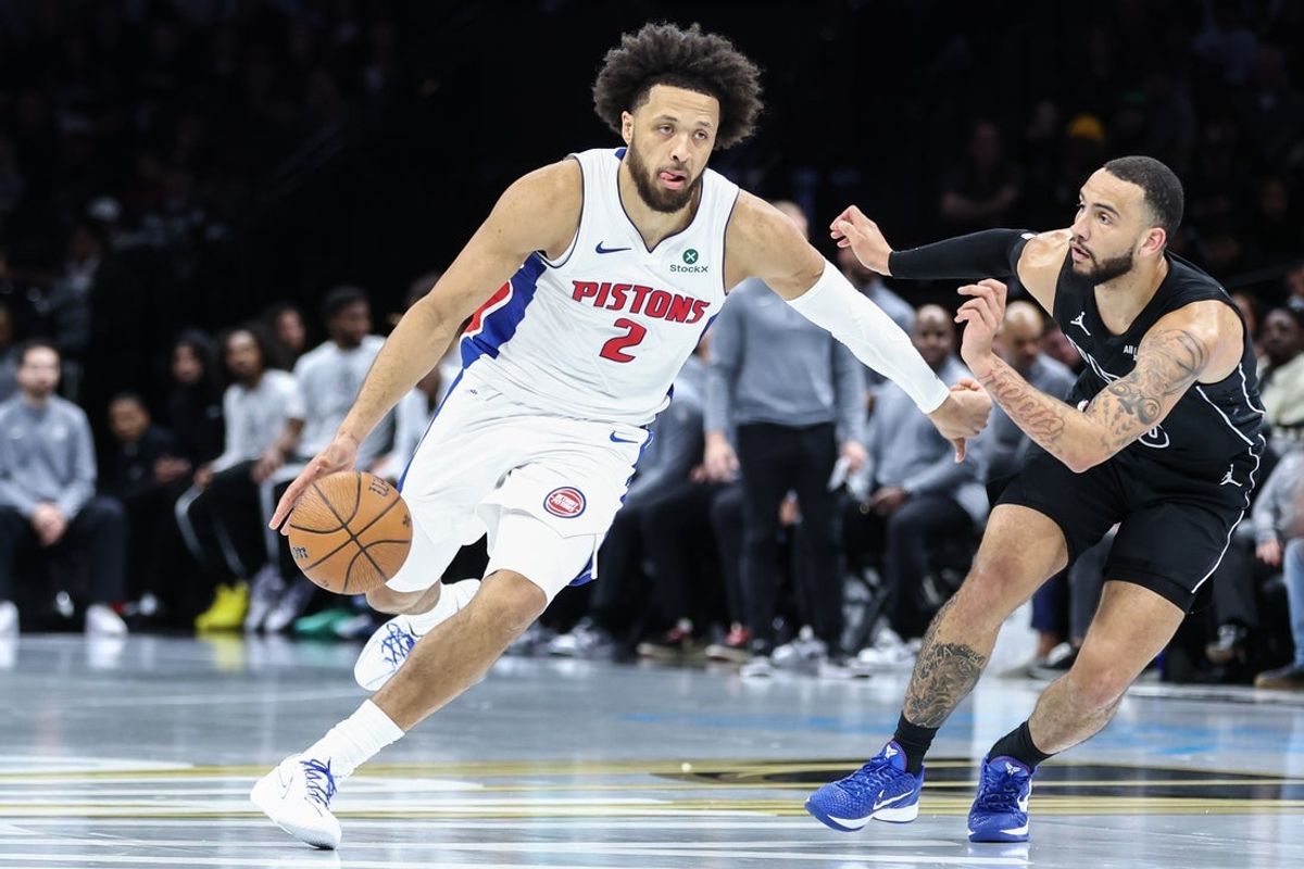Nov 7, 2025; Brooklyn, New York, USA;  Detroit Pistons guard Cade Cunningham (2) looks to drive past Brooklyn Nets guard Tyrese Martin (13) in the second quarter at Barclays Center. Mandatory Credit: Wendell Cruz-Imagn Images