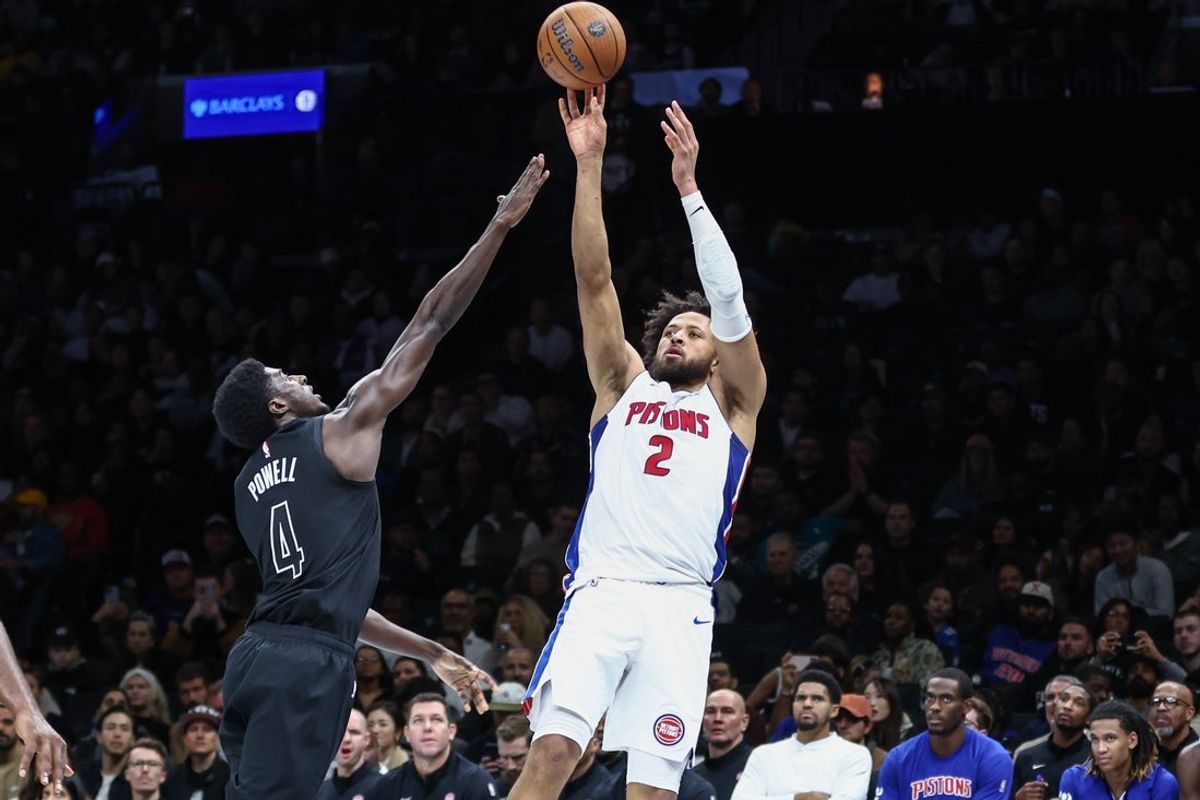 Nov 7, 2025; Brooklyn, New York, USA;  Detroit Pistons guard Cade Cunningham (2) takes a three point shot past Brooklyn Nets guard Drake Powell (4) in the second quarter at Barclays Center. Mandatory Credit: Wendell Cruz-Imagn Images