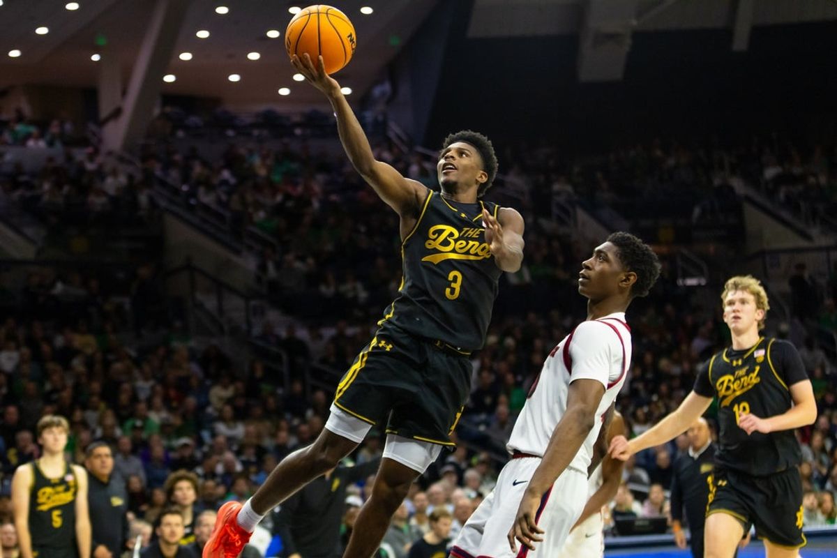 Nov 7, 2025; South Bend, Indiana, USA; Notre Dame Fighting Irish guard Markus Burton (3) drives to the basket as Detroit Mercy Titans guard Nate Johnson (10) defends during the second half at Purcell Pavilion at the Joyce Center. Mandatory Credit: Michael Caterina-Imagn Images