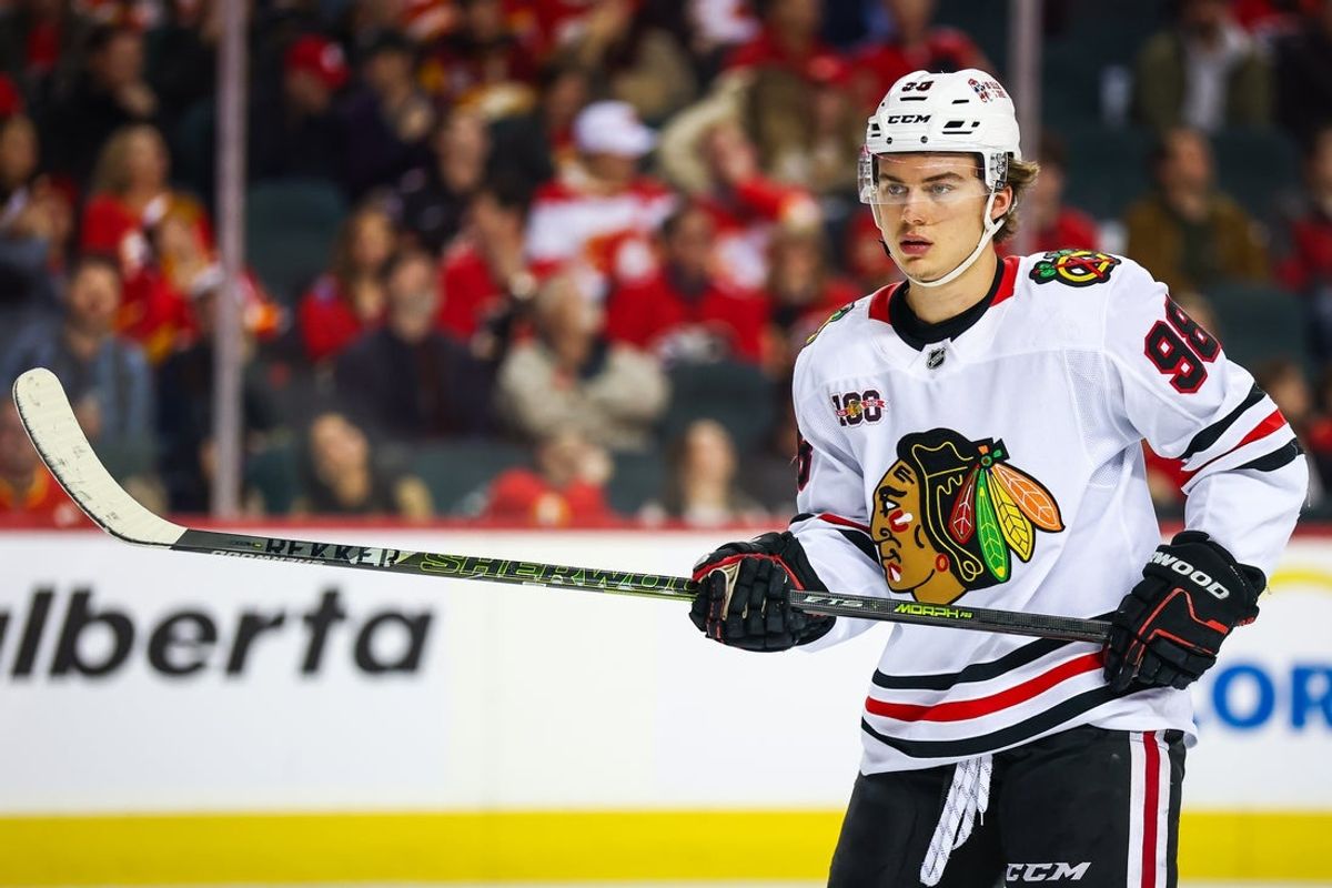 Nov 7, 2025; Calgary, Alberta, CAN; Chicago Blackhawks center Connor Bedard (98) during the face off against the Calgary Flames during the first period at Scotiabank Saddledome. Mandatory Credit: Sergei Belski-Imagn Images