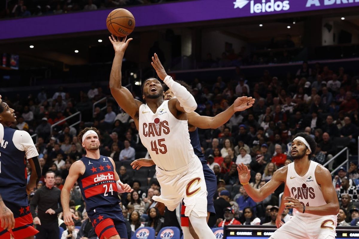 Nov 7, 2025; Washington, District of Columbia, USA; Cleveland Cavaliers guard Donovan Mitchell (45) shoots the ball against the Washington Wizards in the second half in an Emirates NBA Cup game at Capital One Arena. Mandatory Credit: Geoff Burke-Imagn Images