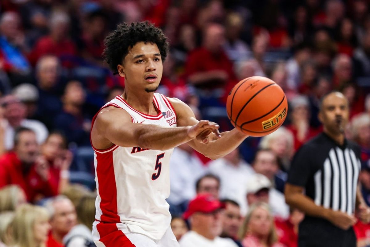 Nov 7, 2025; Tucson, Arizona, USA; Arizona Wildcats guard Brayden Burries (5) passes the ball during the first half of the game against the Utah Tech Trailblazers at McKale Memorial Center. Mandatory Credit: Aryanna Frank-Imagn Images