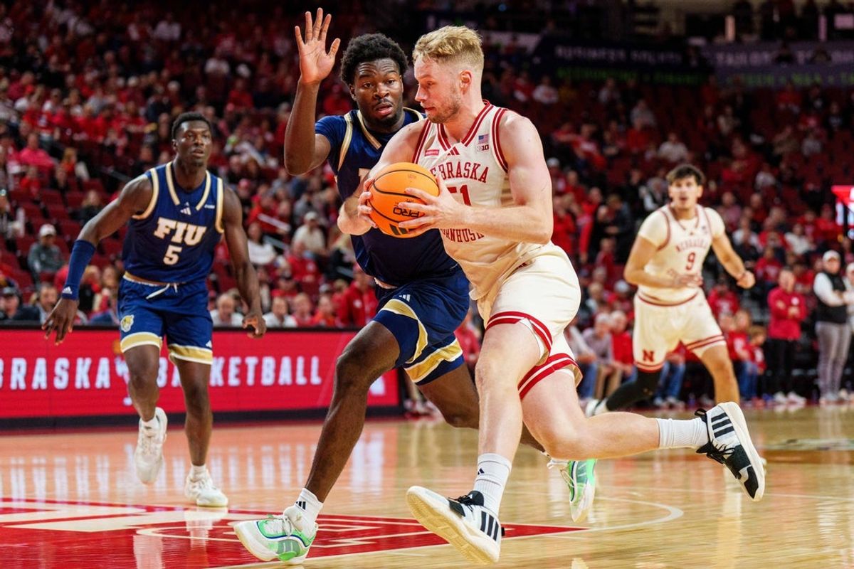 Nov 8, 2025; Lincoln, Nebraska, USA; Nebraska Cornhuskers forward Rienk Mast (51) drives against Florida International Panthers forward Eric Dibami (9) during the first half at Pinnacle Bank Arena. Mandatory Credit: Dylan Widger-Imagn Images