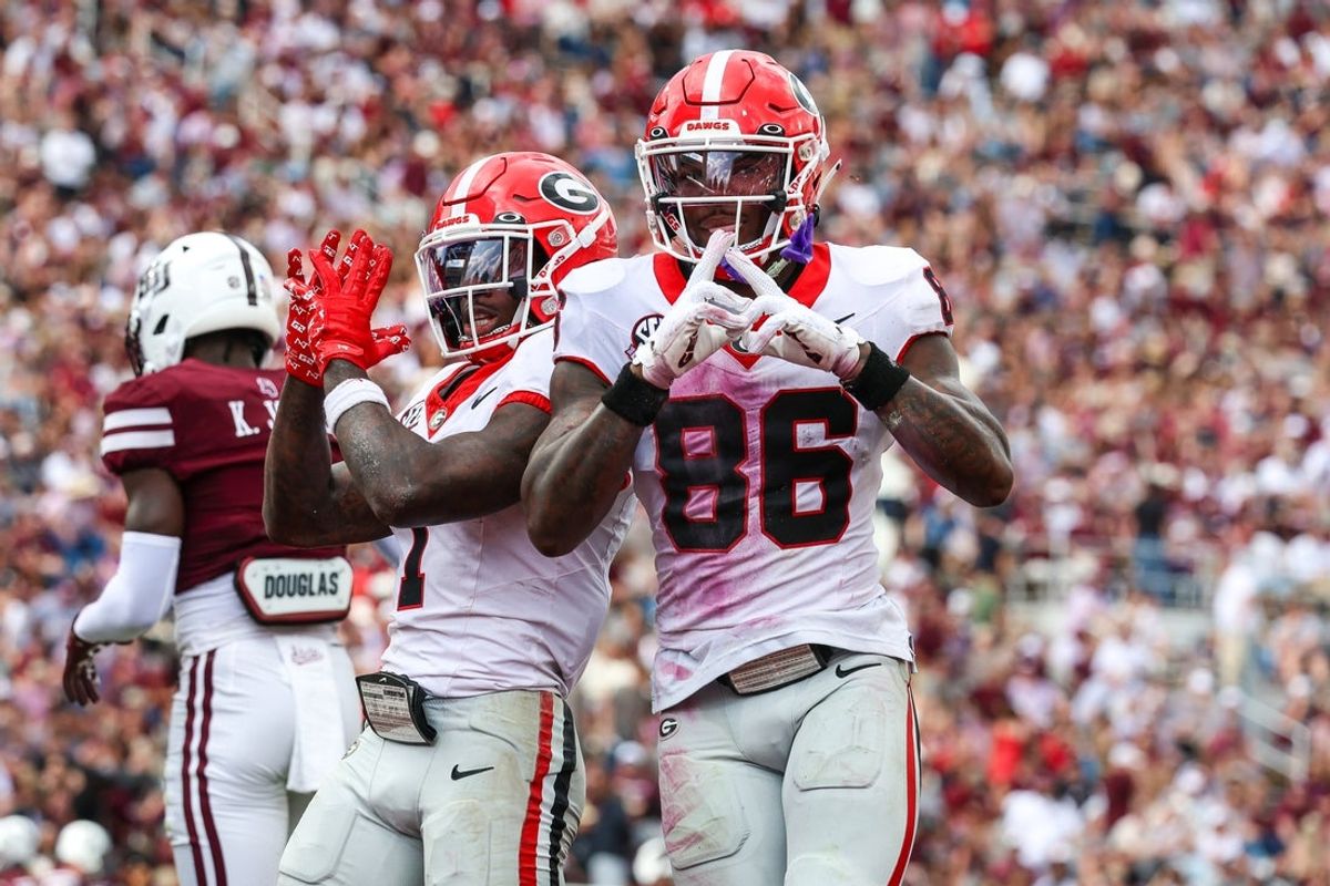 Nov 8, 2025; Starkville, Mississippi, USA; Georgia Bulldogs wide receiver Zachariah Branch (1) and wide receiver Dillon Bell (86) react after a touchdown against the Mississippi State Bulldogs during the first half at Davis Wade Stadium at Scott Field. Mandatory Credit: Wesley Hale-Imagn Images