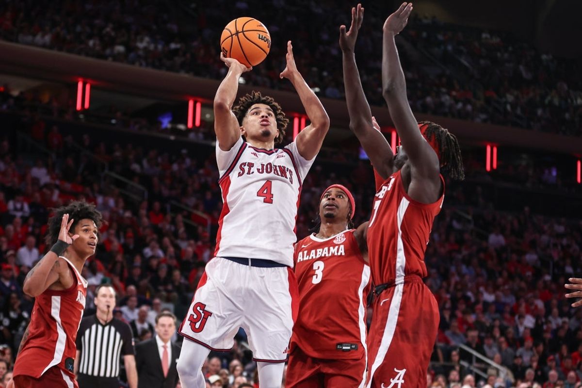 Nov 8, 2025; New York, New York, USA; St. John's Red Storm guard Oziyah Sellers (4) looks to drive past Alabama Crimson Tide forward Taylor Bol Bowen (7) in the second half at Madison Square Garden. Mandatory Credit: Wendell Cruz-Imagn Images
