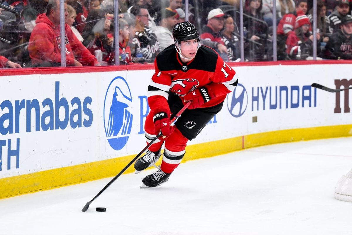Nov 8, 2025; Newark, New Jersey, USA; New Jersey Devils defenseman Simon Nemec (17) skates with the puck against the Pittsburgh Penguins during the third period at Prudential Center. Mandatory Credit: John Jones-Imagn Images