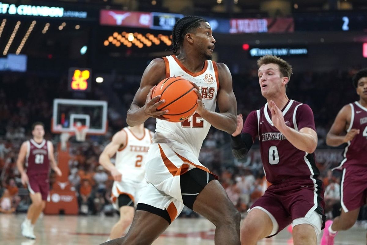 Nov 8, 2025; Austin, Texas, USA; Texas Longhorns guard Tramon Mark (12) drives against Lafayette Leopards guard Ryan Pettit (0) during the second quarter at Moody Center. Mandatory Credit: Dustin Safranek-Imagn Images