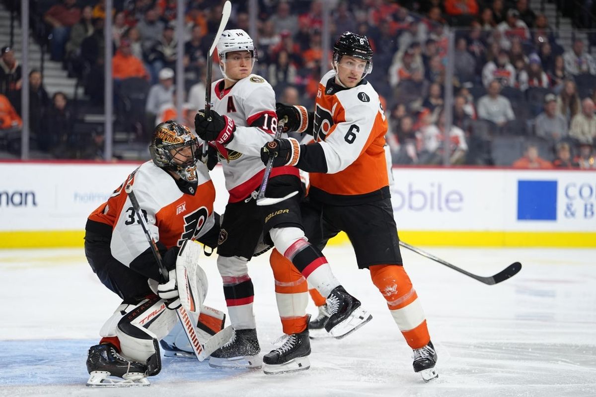 Nov 8, 2025; Philadelphia, Pennsylvania, USA; Philadelphia Flyers defenseman Travis Sanheim (6) hits Ottawa Senators center Tim Stutzle (18) in the third period at Xfinity Mobile Arena. Mandatory Credit: Kyle Ross-Imagn Images