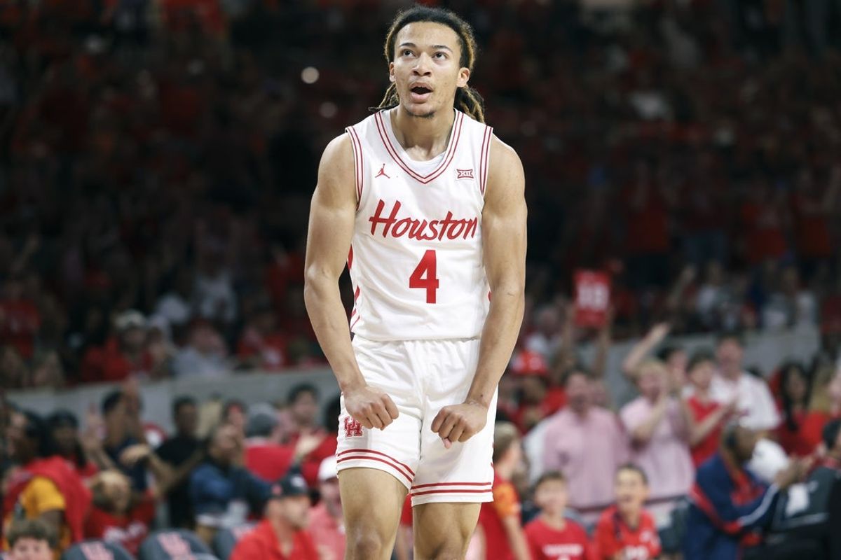Nov 8, 2025; Houston, Texas, USA; Houston Cougars guard Kingston Flemings (4) reacts after scoring a basket during the first half against the Towson Tigers at Fertitta Center. Mandatory Credit: Troy Taormina-Imagn Images