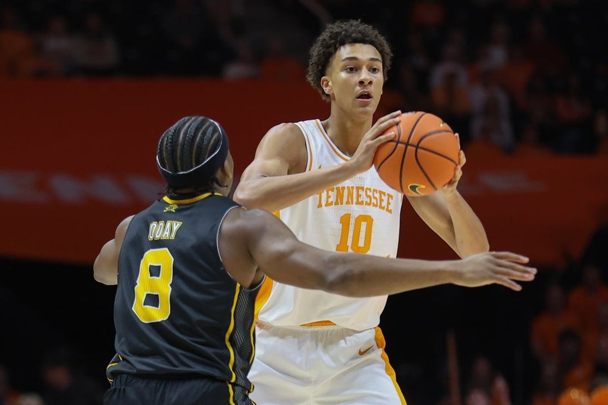 Nov 8, 2025; Knoxville, Tennessee, USA; Tennessee Volunteers forward Nate Ament (10) looks to pass the ball against Northern Kentucky Norse guard Donovan Oday (8)  at Thompson-Boling Arena at Food City Center. Mandatory Credit: Randy Sartin-Imagn Images