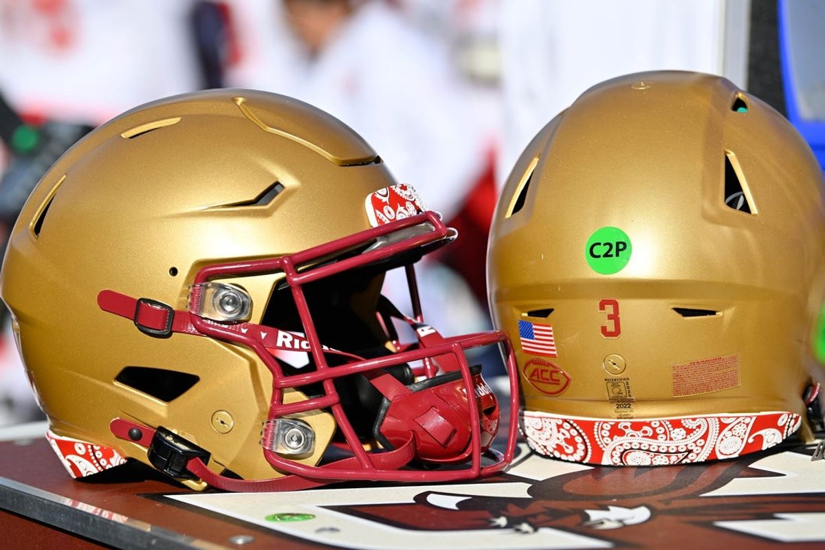 Nov 8, 2025; Chestnut Hill, Massachusetts, USA; A pair of Boston College Eagles helmets trimmed in red paisley in memory of BC alum Welles Remy Crowther are displayed on an equipment cart during the first half against the Southern Methodist University Mustangs at Alumni Stadium. Mandatory Credit: Eric Canha-Imagn Images