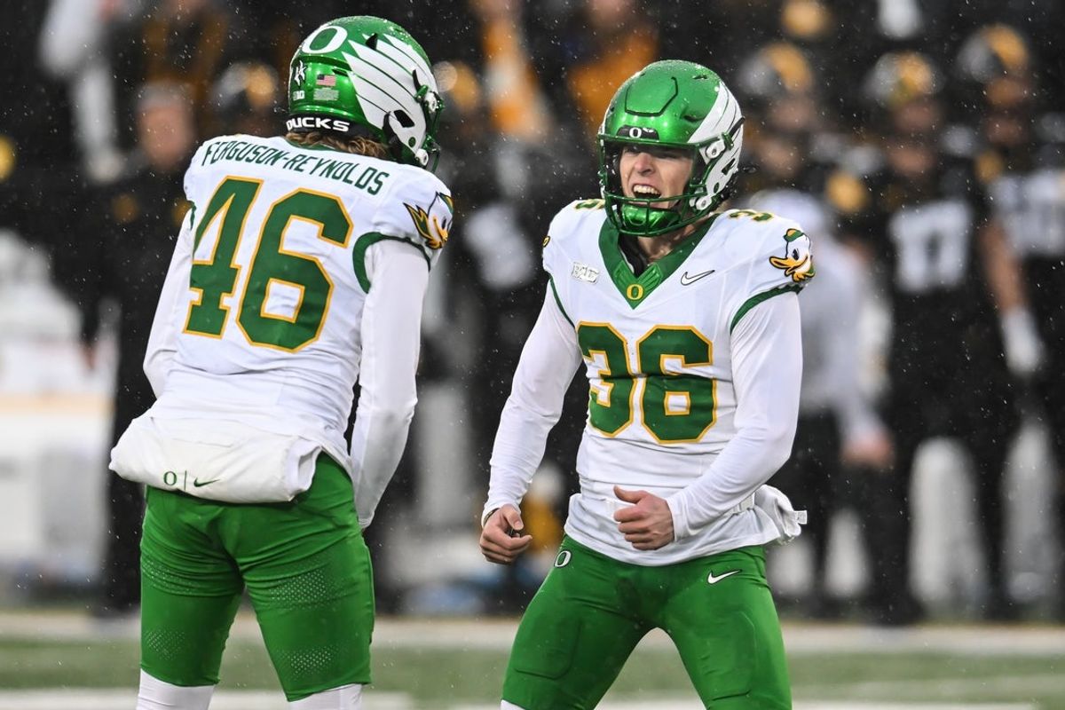 Nov 8, 2025; Iowa City, Iowa, USA; Oregon Ducks kicker Atticus Sappington (36) reacts with holder James Ferguson-Reynolds (46) after kicking a field goal during the second quarter against the Iowa Hawkeyes at Kinnick Stadium. Mandatory Credit: Jeffrey Becker-Imagn Images