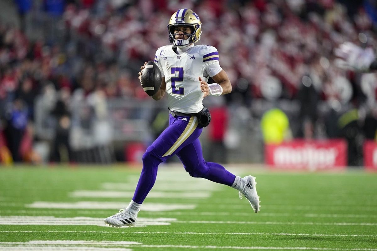 Nov 8, 2025; Madison, Wisconsin, USA;  Washington Huskies quarterback Demond Williams Jr. (2) looks to throw a pass during the second quarter against the Wisconsin Badgers at Camp Randall Stadium. Mandatory Credit: Jeff Hanisch-Imagn Images