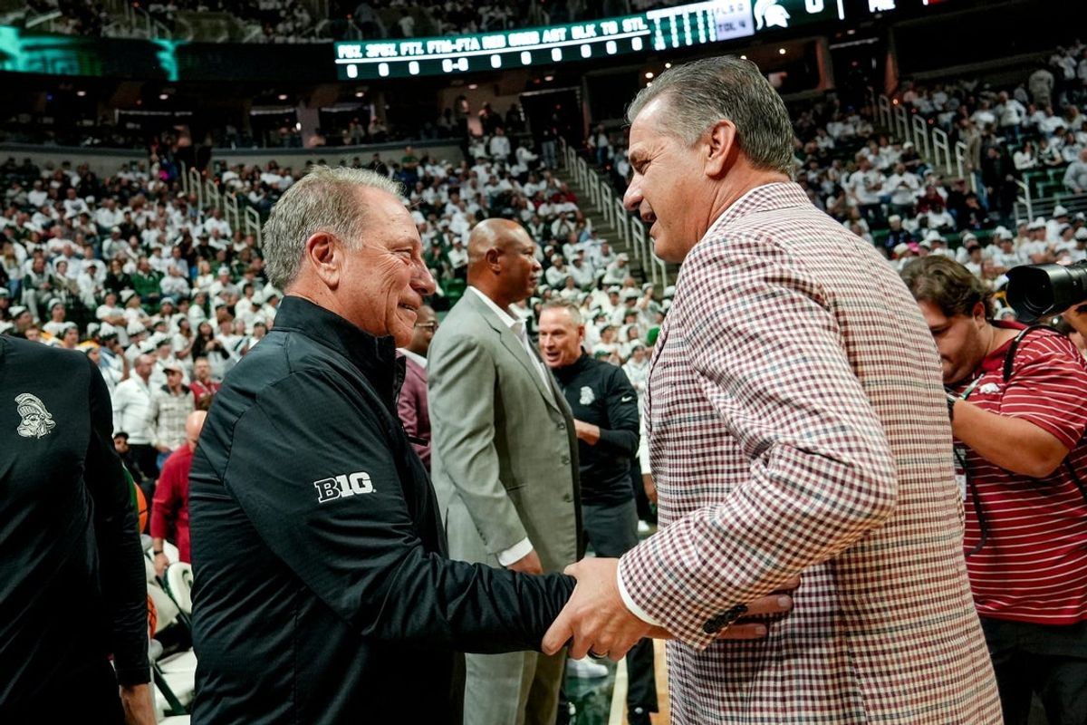 Michigan State's coach Tom Izzo, left, and Arkansas' head coach John Calipari meet before the game on Saturday, Nov. 8, 2025, at the Breslin Center in East Lansing.