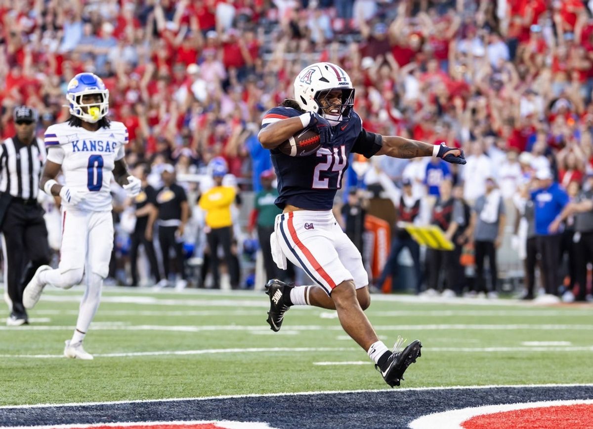 Nov 8, 2025; Tucson, Arizona, USA; Arizona Wildcats running back Quincy Craig (24) celebrates after rushing for a touchdown against the Kansas Jayhawks in the second half at Arizona Stadium. Mandatory Credit: Mark J. Rebilas-Imagn Images
