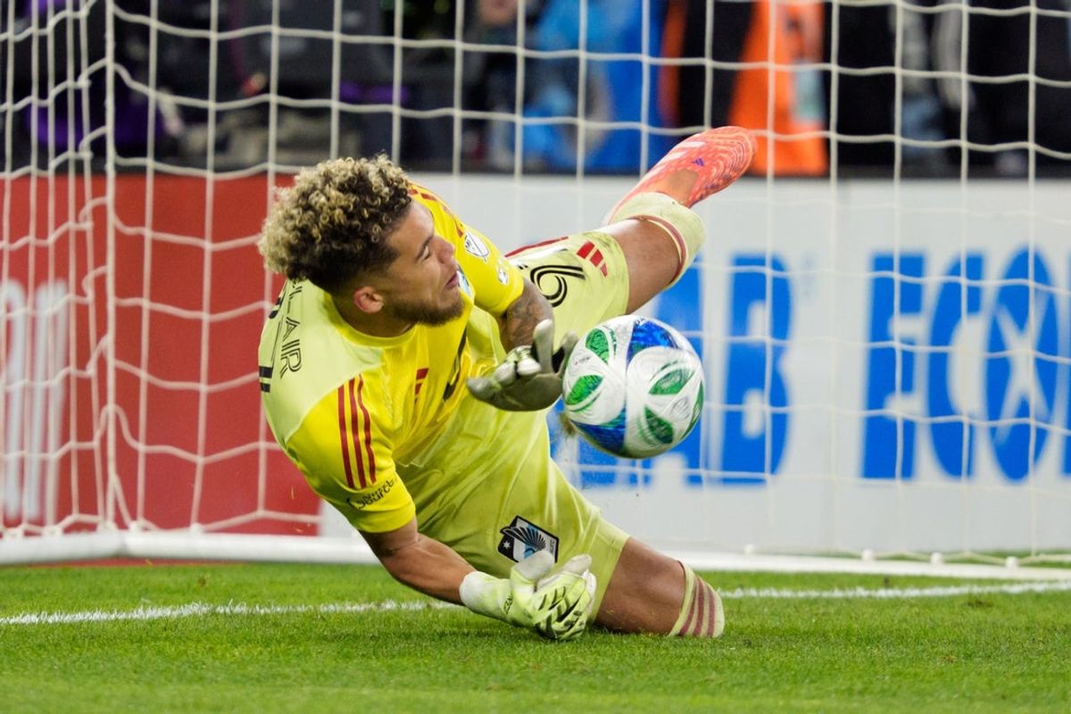 Nov 8, 2025; Saint Paul, Minnesota, USA; Minnesota United goalkeeper Dayne St. Clair (97) saves a shot by Seattle Sounders forward Osaze de Rosario (95) in penalty kicks after the game ended with a tie at Allianz Field. Mandatory Credit: Matt Blewett-Imagn Images
