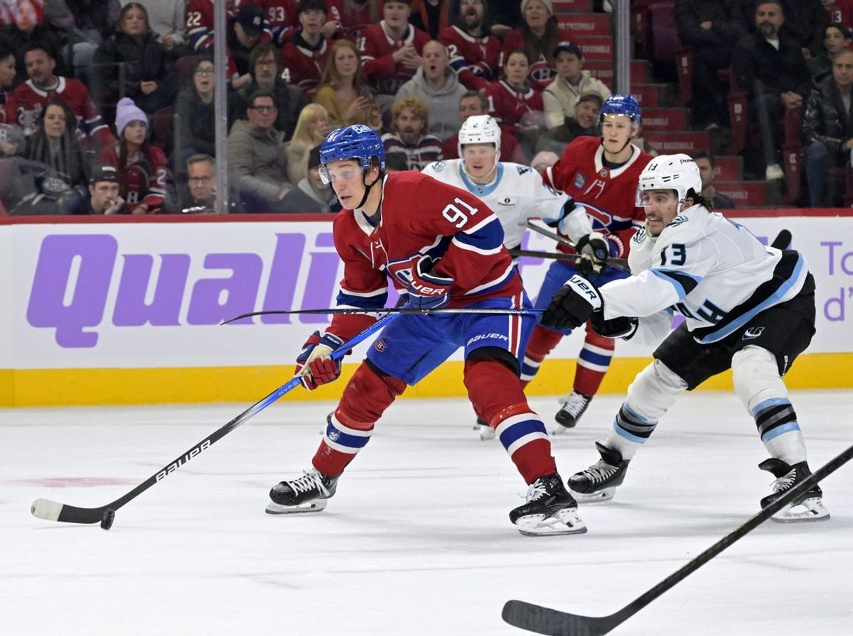 Nov 8, 2025; Montreal, Quebec, CAN; Montreal Canadiens forward Oliver Kapanen (91) scores a goal and Utah Mammoth forward Brandon Tanev (13) defends during the first period at the Bell Centre. Mandatory Credit: Eric Bolte-Imagn Images