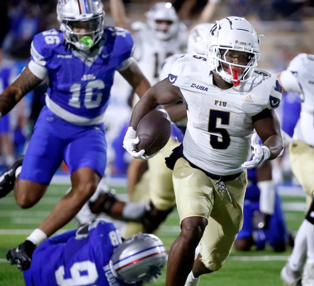 FIU running back Kejon Owens (5) runs the ball into the end zone for a touchdown against Middle Tennessee during the college football game at MTSU, on Saturday, Nov. 8, 2025.