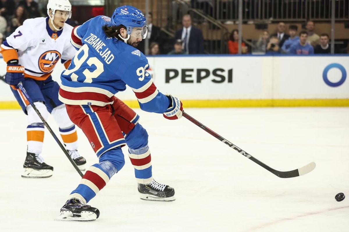 Nov 8, 2025; New York, New York, USA;  New York Rangers center Mika Zibanejad (93) attempts a shot on goal in the first period against the New York Islanders at Madison Square Garden. Mandatory Credit: Wendell Cruz-Imagn Images