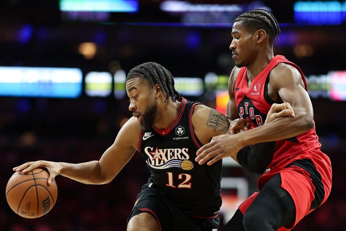 Nov 8, 2025; Philadelphia, Pennsylvania, USA; Philadelphia 76ers forward Trendon Watford (12) controls the ball against Toronto Raptors forward RJ Barrett (9) during the second quarter at Xfinity Mobile Arena. Mandatory Credit: Bill Streicher-Imagn Images