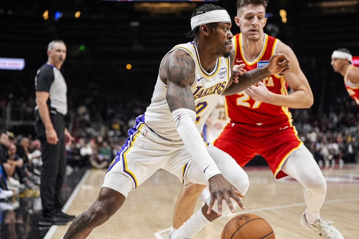 Nov 8, 2025; Atlanta, Georgia, USA; Los Angeles Lakers forward Jarred Vanderbilt (2) dribbles against Atlanta Hawks guard Vit Krejci (27) during the first half at State Farm Arena. Mandatory Credit: Dale Zanine-Imagn Images