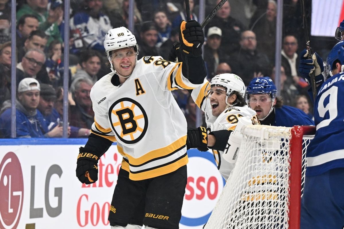 Nov 8, 2025; Toronto, Ontario, CAN;  Boston Bruins forward David Pastrnak (88) celebrates with forward Marat Khusnutdinov (92)after scoring a goal against the Toronto Maple Leafs in the second period at Scotiabank Arena. Mandatory Credit: Dan Hamilton-Imagn Images