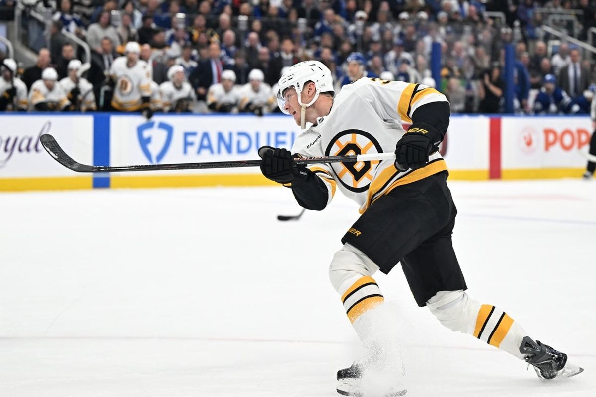 Nov 8, 2025; Toronto, Ontario, CAN;  Boston Bruins forward Morgan Geekie (39) shoots the puck against the Toronto Maple Leafs in the second period at Scotiabank Arena. Mandatory Credit: Dan Hamilton-Imagn Images