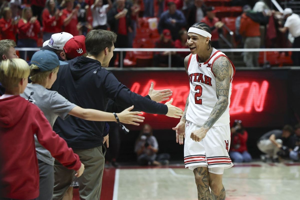 Nov 8, 2025; Salt Lake City, Utah, USA; Utah Utes guard Terrence Brown (2) interacts with fans after an overtime win against the Weber State Wildcats at Jon M. Huntsman Center. Mandatory Credit: Rob Gray-Imagn Images