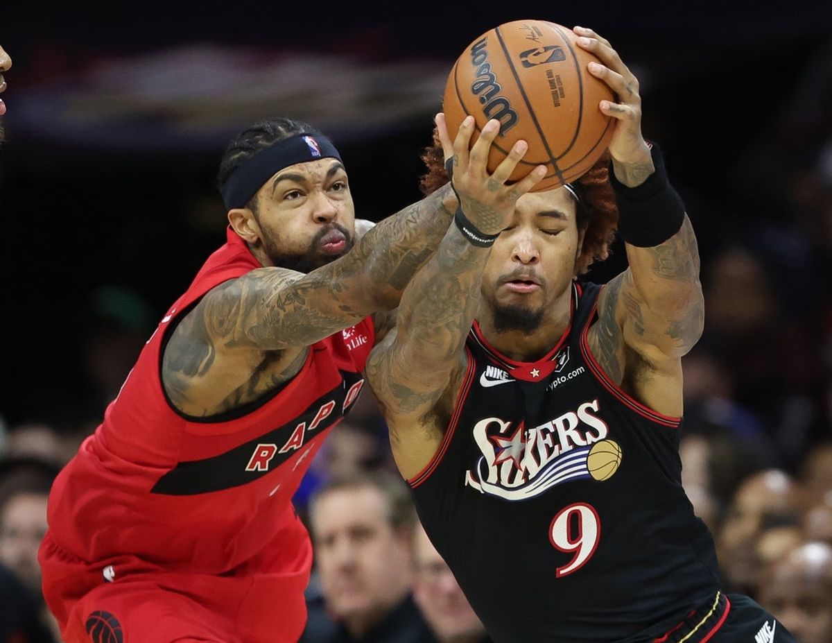 Nov 8, 2025; Philadelphia, Pennsylvania, USA; Toronto Raptors forward Brandon Ingram (3) fouls Philadelphia 76ers guard Kelly Oubre Jr. (9) while going for the ball during the fourth quarter at Xfinity Mobile Arena. Mandatory Credit: Bill Streicher-Imagn Images
