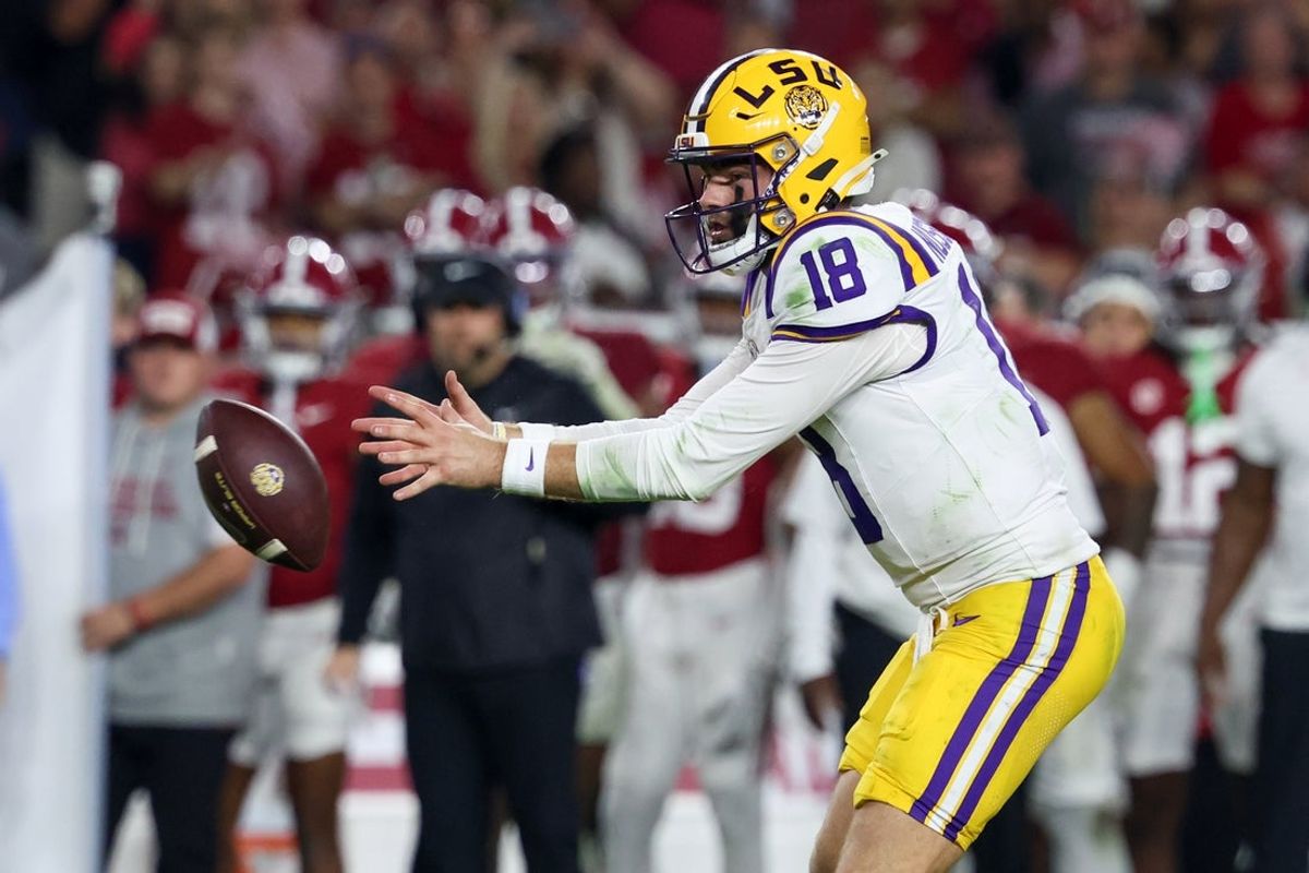 Nov 8, 2025; Tuscaloosa, Alabama, USA; Louisiana State Tigers quarterback Garrett Nussmeier (18) catches the snap against the Alabama Crimson Tide during the third quarter of the game at Saban Field at Bryant-Denny Stadium. Mandatory Credit: David Leong-Imagn Images