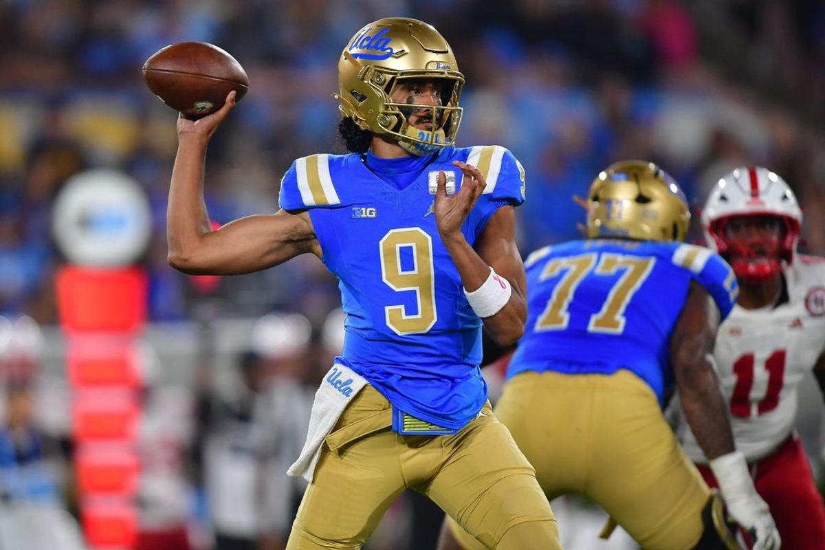 Nov 8, 2025; Pasadena, California, USA; UCLA Bruins quarterback Nico Iamaleava (9) throws against the Nebraska Cornhuskers during the first half at the Rose Bowl. Mandatory Credit: Gary A. Vasquez-Imagn Images