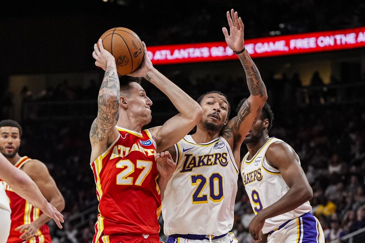 Nov 8, 2025; Atlanta, Georgia, USA; Atlanta Hawks guard Vit Krejci (27) works against Los Angeles Lakers guard Nick Smith Jr. (20) during the second half at State Farm Arena. Mandatory Credit: Dale Zanine-Imagn Images